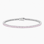 Silver bracelet with pink gemstones on a white background